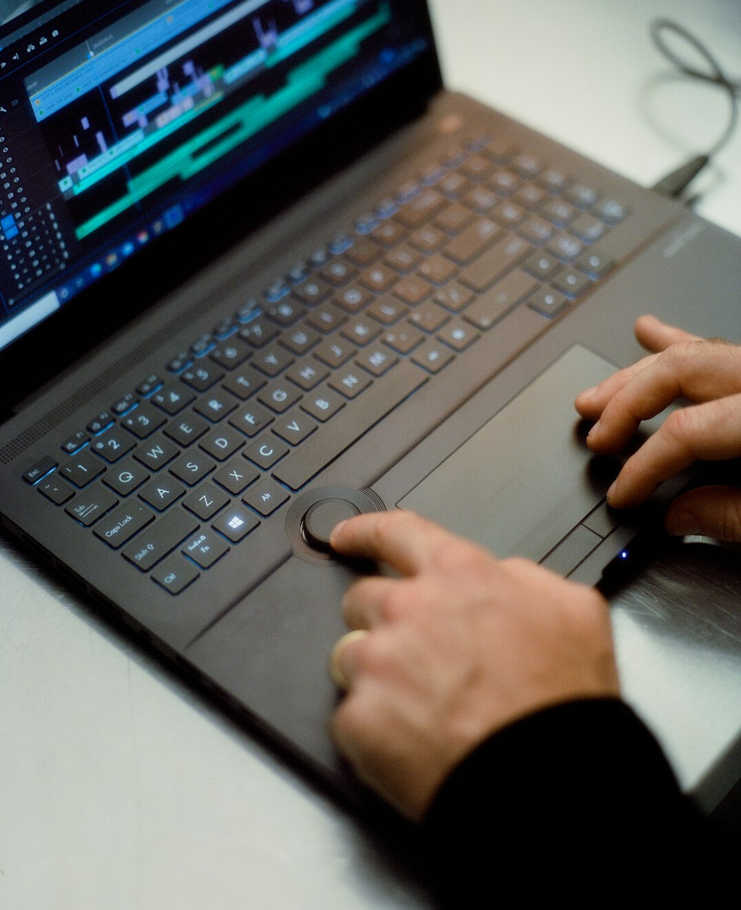 video editor working on computer
