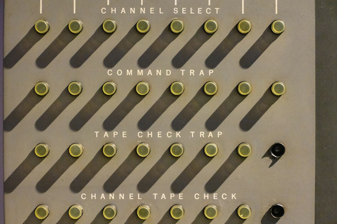 Close-up of a color grading panel with trackballs and film timeline