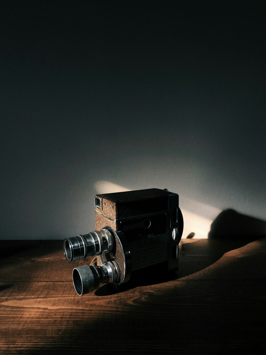 Cinema camera on a tripod with softbox lighting on set