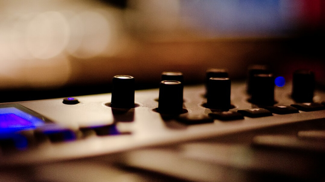 Audio mixing console with faders for sound editing